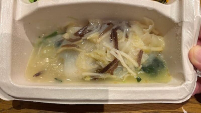 Image of white fish and vegetables in a clear broth sauce